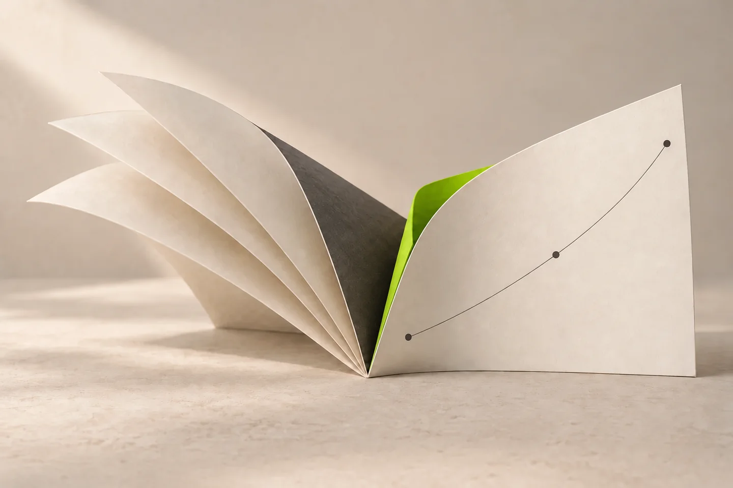 Ivory paper leaves open into a sculptural ledger with a bright lime inner page.
